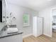 Bathroom featuring granite countertops, hardwood floors, and a large window at 511 Doctors Dr, Oviedo, FL 32765
