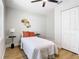 Bright bedroom featuring a ceiling fan, wood-look floors and closet at 511 Doctors Dr, Oviedo, FL 32765