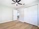 Bedroom featuring hardwood floors, a closet, a window, and a ceiling fan at 511 Doctors Dr, Oviedo, FL 32765
