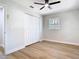 Bedroom featuring hardwood floors, a closet, a window, and a ceiling fan at 511 Doctors Dr, Oviedo, FL 32765