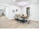 Bright dining area featuring a wooden table, upholstered chairs, and open access to other living spaces at 511 Doctors Dr, Oviedo, FL 32765