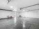 Garage with epoxy floor and large roll-up door at 511 Doctors Dr, Oviedo, FL 32765