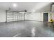 Spacious garage with epoxy floor and large roll-up door at 511 Doctors Dr, Oviedo, FL 32765