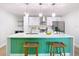 Bright modern kitchen with white cabinets, stainless steel appliances, and island seating at 511 Doctors Dr, Oviedo, FL 32765