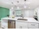 Modern kitchen featuring stainless steel appliances, white cabinetry, and stylish pendant lighting over the island at 511 Doctors Dr, Oviedo, FL 32765