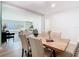 Open-concept living and dining area with stylish decor, light wood floors, and comfortable seating at 511 Doctors Dr, Oviedo, FL 32765