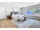 Inviting main bedroom with bright natural light, hardwood floors, and seating at 511 Doctors Dr, Oviedo, FL 32765
