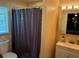 Standard bathroom with a shower behind a curtain and vanity with storage at 516 Hickorywood Ave, Altamonte Springs, FL 32714
