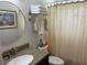 Bright bathroom with granite sink, towel rack, and toilet under neutral shower curtain at 516 Hickorywood Ave, Altamonte Springs, FL 32714