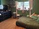 Eclectic bedroom with wood floors, lots of natural light, and bright wall decor at 516 Hickorywood Ave, Altamonte Springs, FL 32714