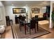 Inviting dining area with modern table, decorative rug, and seamlessly connected to the living space at 516 Hickorywood Ave, Altamonte Springs, FL 32714