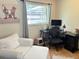 Home office with lots of natural light, desk, and white armchair at 516 Hickorywood Ave, Altamonte Springs, FL 32714