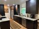 Modern kitchen with stainless steel appliances, sleek cabinetry, granite countertops, and lots of natural light at 516 Hickorywood Ave, Altamonte Springs, FL 32714
