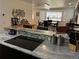 Well-appointed kitchen counter with electric cooktop featuring views of the breakfast and dining area at 516 Hickorywood Ave, Altamonte Springs, FL 32714