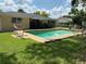 Backyard swimming pool with a hammock and patio seating at 516 Hickorywood Ave, Altamonte Springs, FL 32714