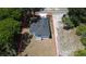An aerial view shows a home with a new roof, a boundary line, and limited landscaping on a partially wooded lot at 544 E Voorhis Ave, Deland, FL 32724
