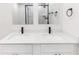 Modern bathroom featuring double sink vanity with matte black hardware at 544 E Voorhis Ave, Deland, FL 32724