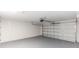 Spacious two car garage with painted floor and automatic door at 544 E Voorhis Ave, Deland, FL 32724