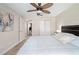 Spacious bedroom with a ceiling fan and a view that leads to an additional room at 5496 S Nova Rd, Port Orange, FL 32127