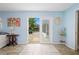 Bedroom with blue walls and a view of the pool and outdoor seating area at 5496 S Nova Rd, Port Orange, FL 32127