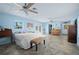 Large bedroom featuring tile floors and two ceiling fans at 5496 S Nova Rd, Port Orange, FL 32127