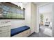 Comfortable reading nook with a blue bench, a window with blinds, and a storage cabinet at 5496 S Nova Rd, Port Orange, FL 32127
