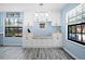Inviting breakfast nook featuring built-in bench seating, white cabinets, and bright windows at 5496 S Nova Rd, Port Orange, FL 32127