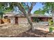 Charming single-story home with a well-maintained lawn, mature trees, and attached two-car garage at 5496 S Nova Rd, Port Orange, FL 32127
