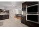 Well-lit kitchen featuring stainless steel appliances, modern cabinets, and an island with a granite countertop at 5496 S Nova Rd, Port Orange, FL 32127