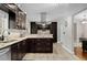 Modern kitchen has granite counters, stainless appliances, and custom cabinetry at 5496 S Nova Rd, Port Orange, FL 32127