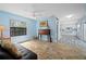 Bright living room with tile floors, complemented by a kitchen view, enhancing the home's open layout at 5496 S Nova Rd, Port Orange, FL 32127