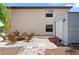 Backyard stone patio with fire pit, seating, and storage shed at 5496 S Nova Rd, Port Orange, FL 32127