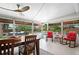Cozy porch featuring outdoor seating, a dining table and a view of the pool at 5496 S Nova Rd, Port Orange, FL 32127