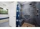 Walk-in shower with a tile surround, a rainfall shower head, a bench, and grab bars at 5496 S Nova Rd, Port Orange, FL 32127
