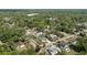 A serene neighborhood showcases mature trees and well-maintained homes from an elevated perspective at 560 Sumner Ave, Orange City, FL 32763