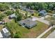 Aerial view of a single-Gathering home featuring a well-maintained lawn and neutral exterior at 560 Sumner Ave, Orange City, FL 32763