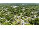 Aerial view of the home located in a neighborhood with lots of trees and other houses at 560 Sumner Ave, Orange City, FL 32763