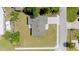 Aerial view showcasing the home's roof, driveway, and surrounding lawn at 560 Sumner Ave, Orange City, FL 32763