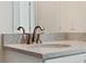 Close up on bathroom faucet and granite countertop at 560 Sumner Ave, Orange City, FL 32763