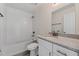Bathroom with tub and vanity with granite countertop at 560 Sumner Ave, Orange City, FL 32763