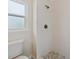 Bathroom with tiled shower and brushed bronze fixtures at 560 Sumner Ave, Orange City, FL 32763