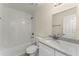 Well-lit bathroom features a white tiled shower and granite vanity top at 560 Sumner Ave, Orange City, FL 32763