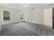 Empty bedroom with ample space, natural light, and plush carpeting at 560 Sumner Ave, Orange City, FL 32763