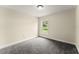 Bedroom featuring carpet flooring and natural light from the window at 560 Sumner Ave, Orange City, FL 32763