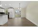 Open dining area with sliding glass doors and view to the backyard and kitchen at 560 Sumner Ave, Orange City, FL 32763