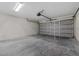A spacious garage with a gray door and sealed concrete flooring at 560 Sumner Ave, Orange City, FL 32763