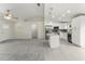 Open-concept living space and kitchen featuring modern appliances and finishes at 560 Sumner Ave, Orange City, FL 32763