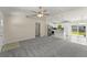 Spacious living room and kitchen area with modern finishes and plenty of natural light at 560 Sumner Ave, Orange City, FL 32763