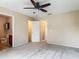 Comfortable bedroom with doorway to a bathroom and neutral color palette at 564 Mount Olympus Blvd, New Smyrna Beach, FL 32168