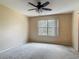 Neutral bedroom features large windows, providing lots of natural light at 564 Mount Olympus Blvd, New Smyrna Beach, FL 32168